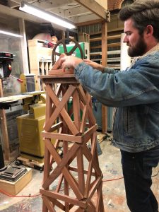 a man building a tower